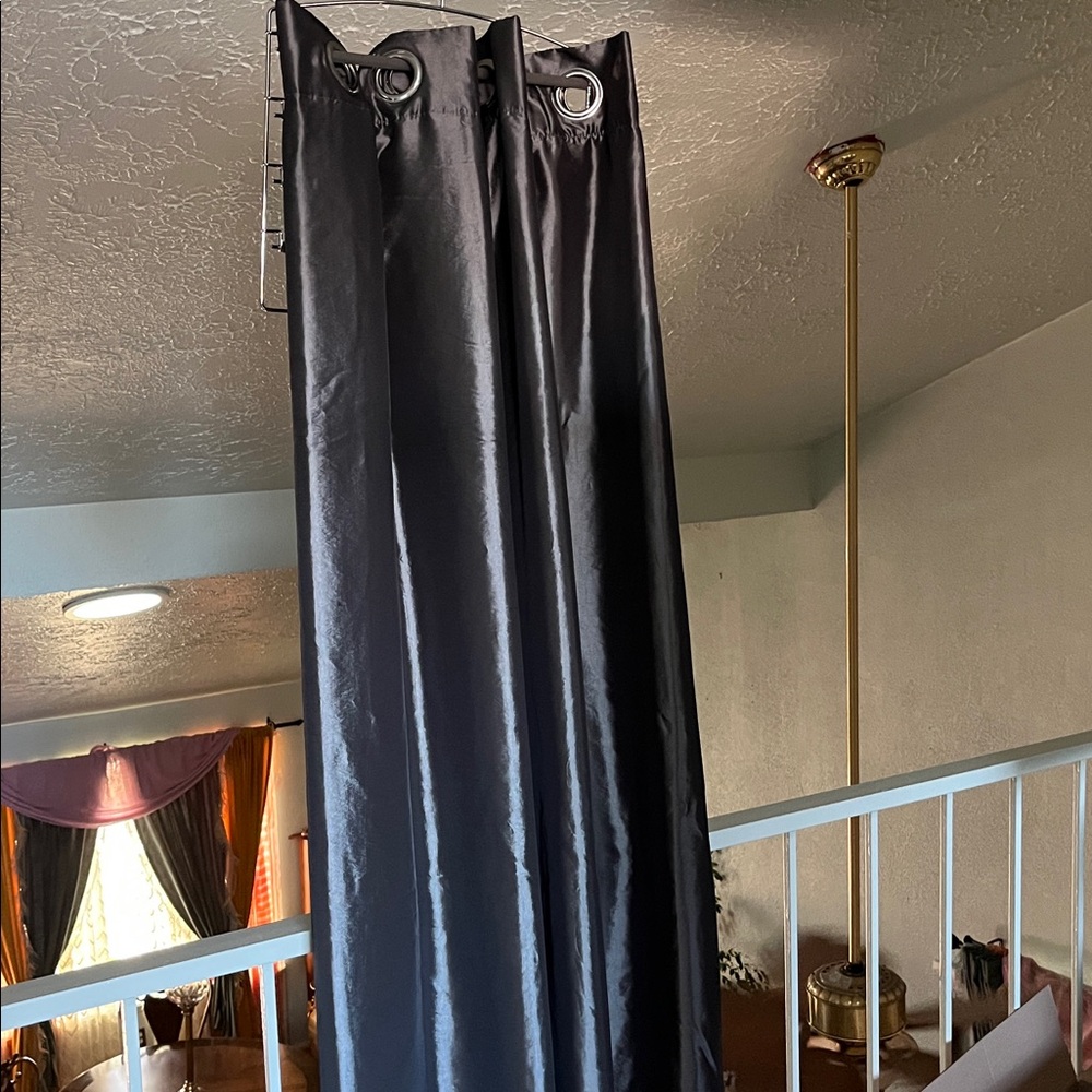 Dark gray lined Grommet Top Curtains. 52x72”
One panel only.